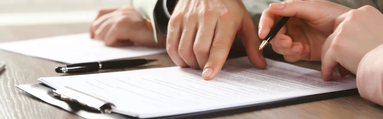 person pointing a commercial law clauses